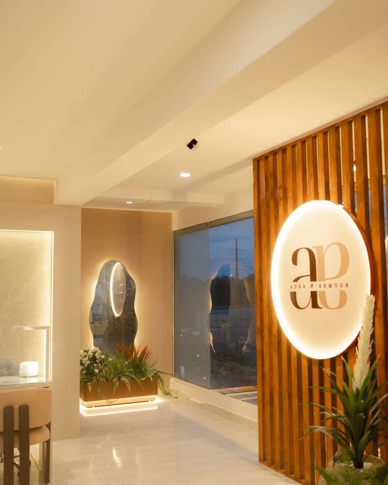 Salon entryway with wood slat wall and glowing circular emblem