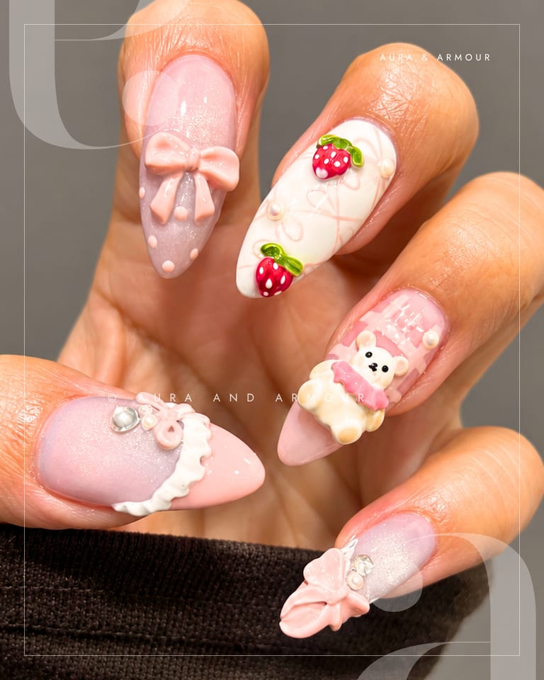 3d charm nails with pink bows strawberries and a teddy bear
