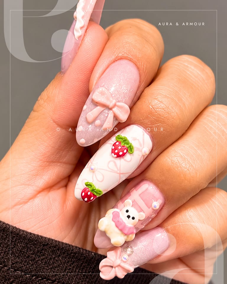3d charm nails with pink bows strawberries and a teddy bear