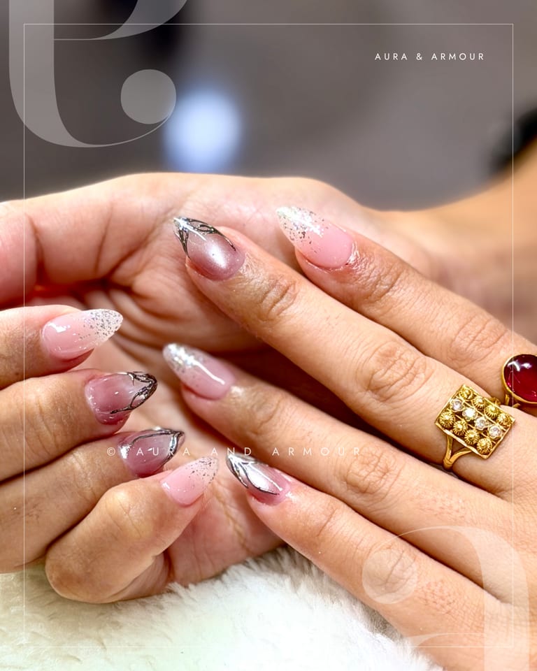 Sheer pink with silver chrome tips and glitter fade